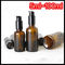 ブラウン色の精油の化粧品のローションのためのガラス点滴器のびんの黒ポンプ サプライヤー